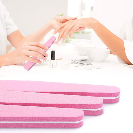 Autera SmoothBuff in use for nail polishing during a manicure session with pink buffing blocks.