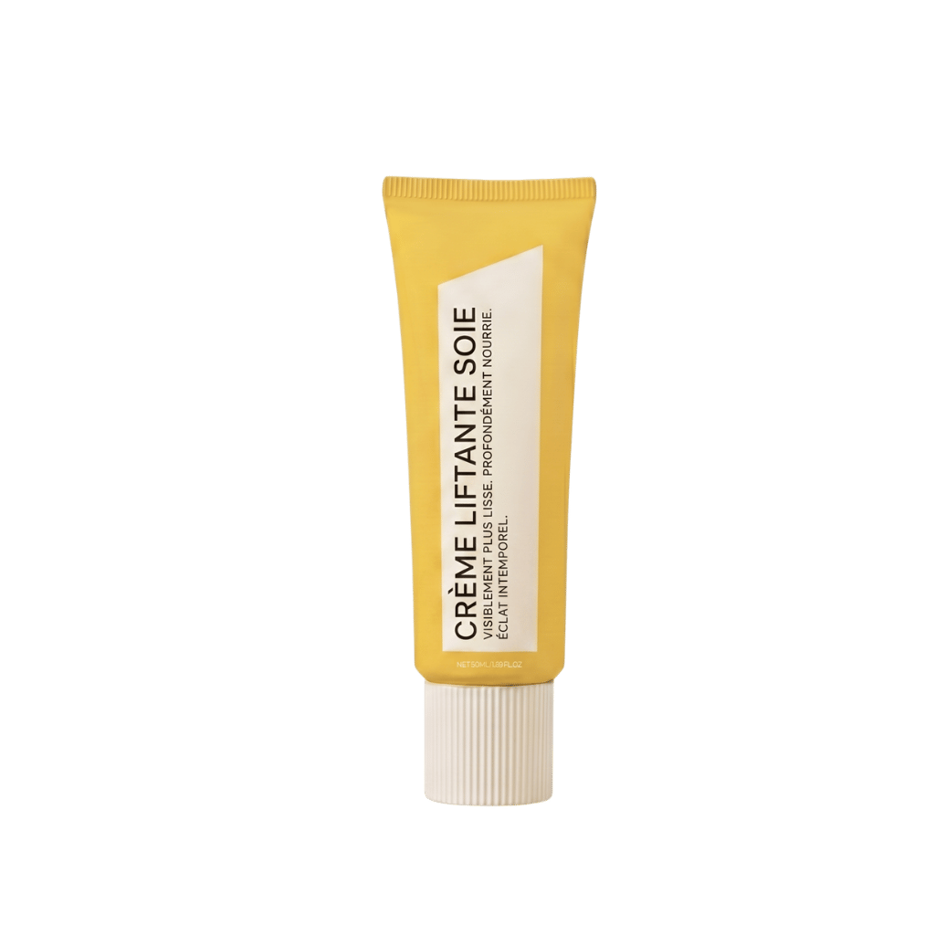 Crème Liftante Soie dans un tube jaune, crème de beauté à effet liftant pour une peau plus ferme et lisse.
