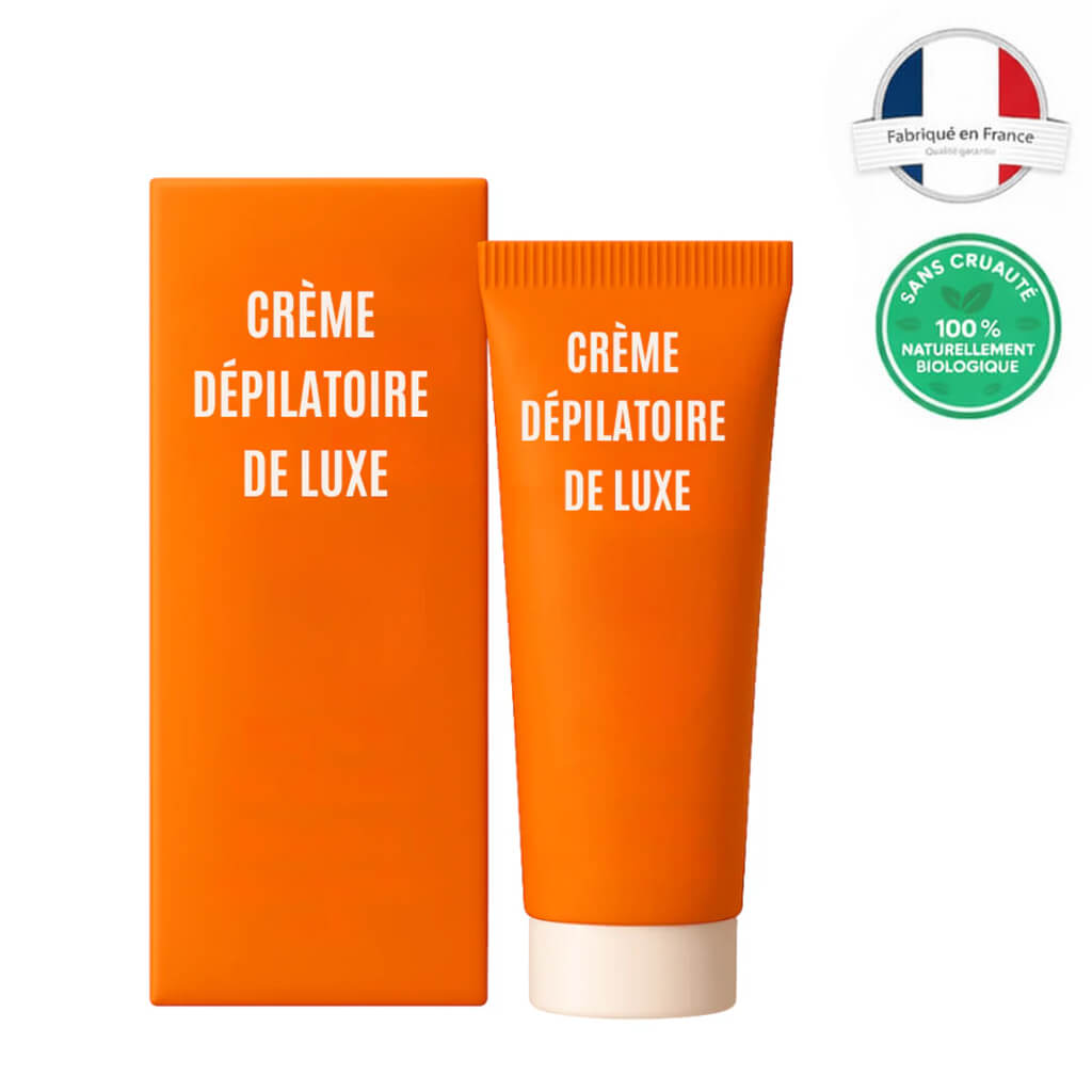 Crème dépilatoire de luxe en tube et boîte orange, produit cosmétique pour peau lisse et soignée.